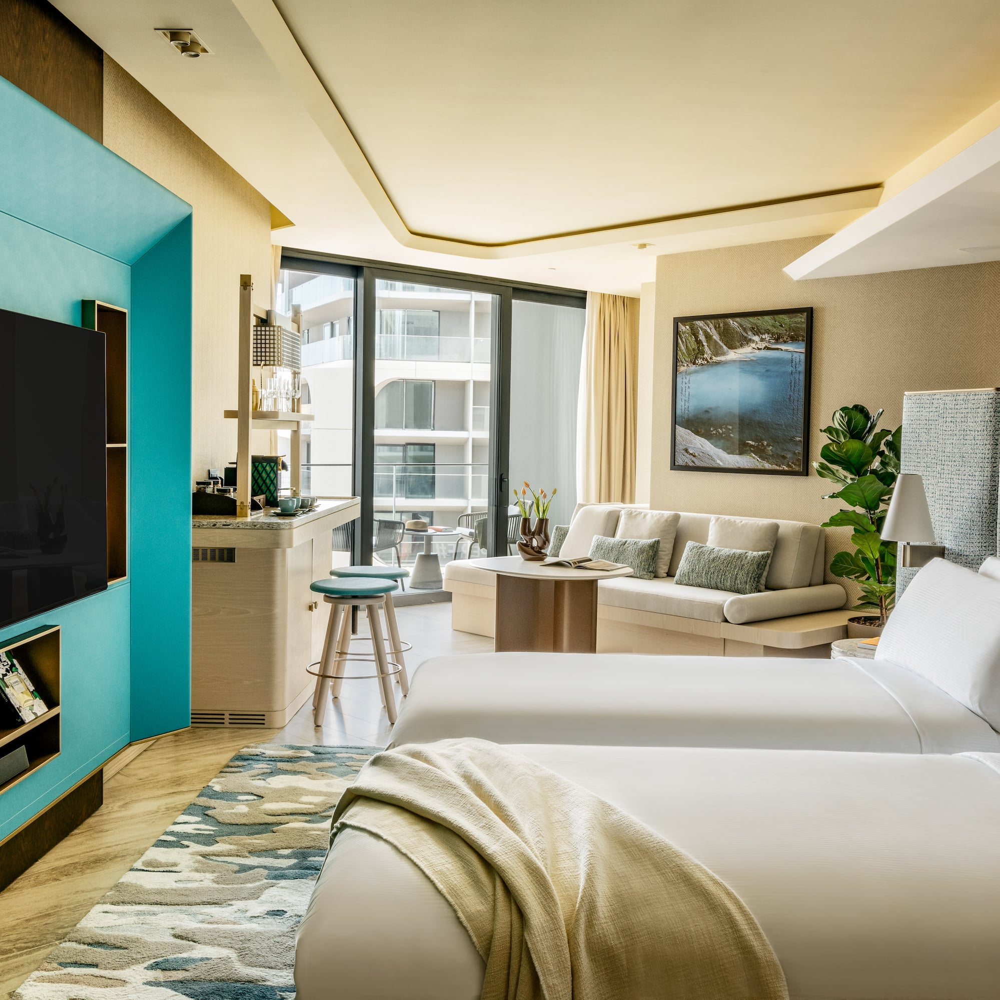 a room with two beds and a tv