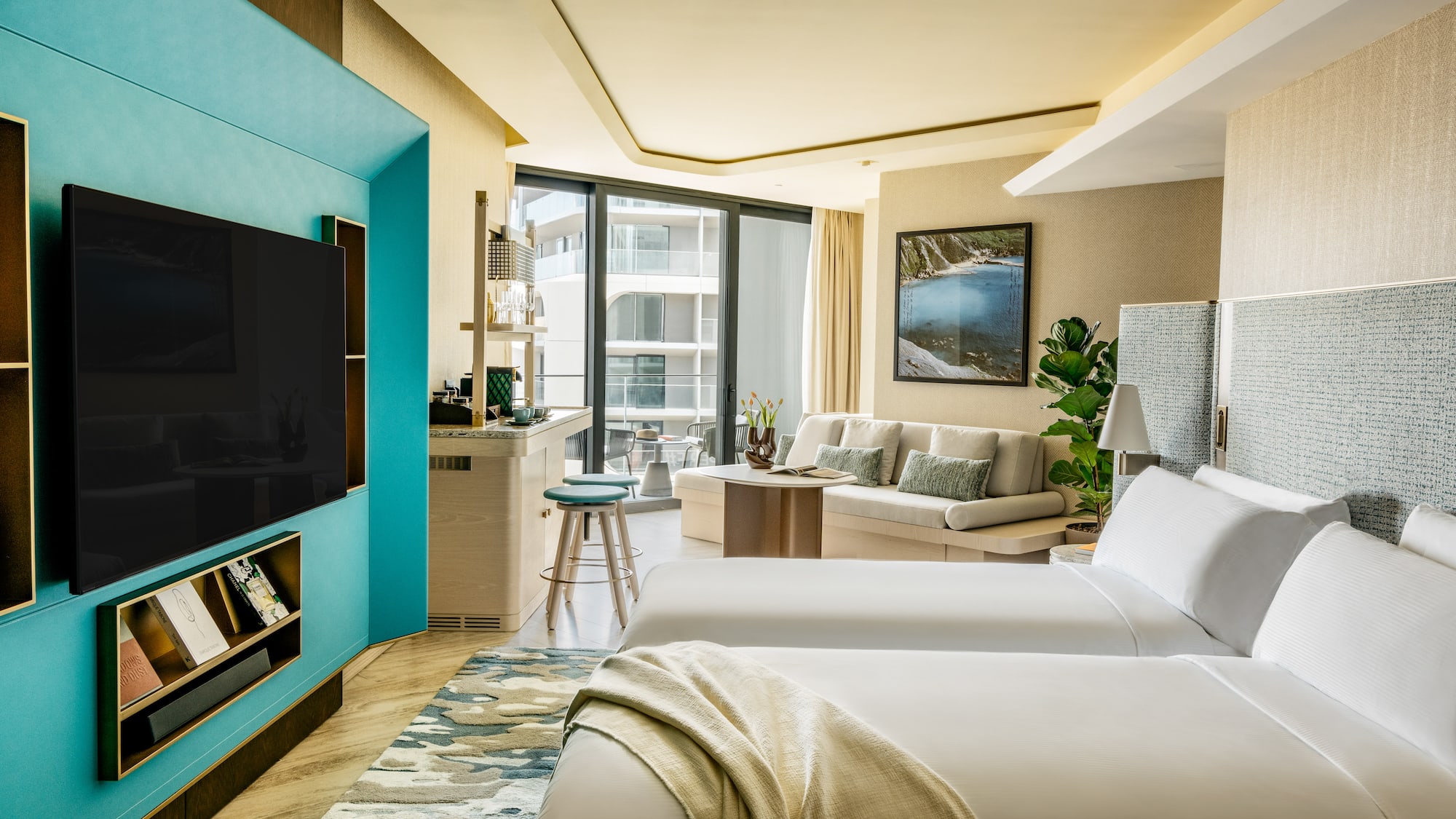 a room with two beds and a tv