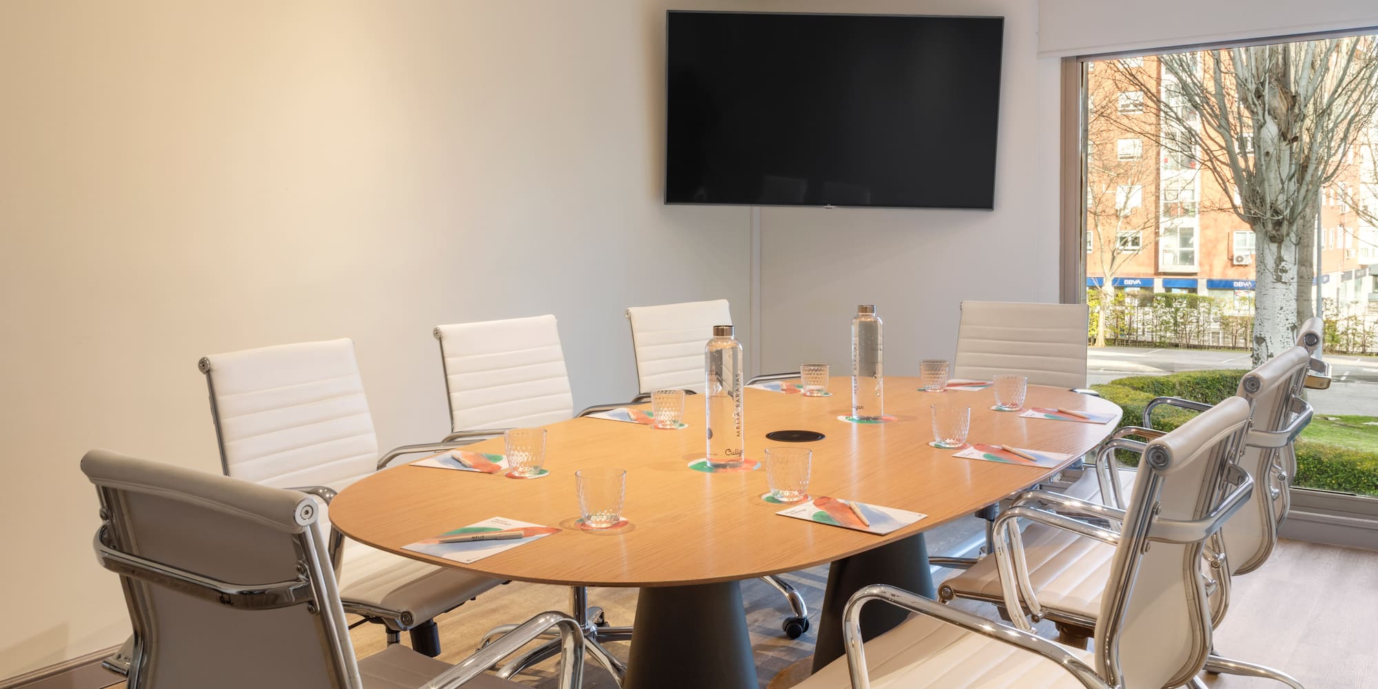 a conference room with a table and chairs