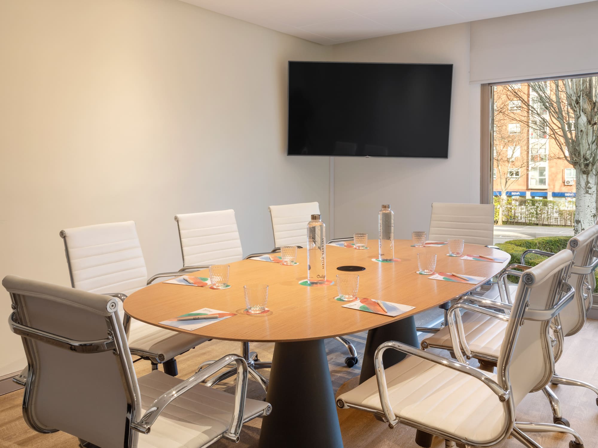 a conference room with a table and chairs