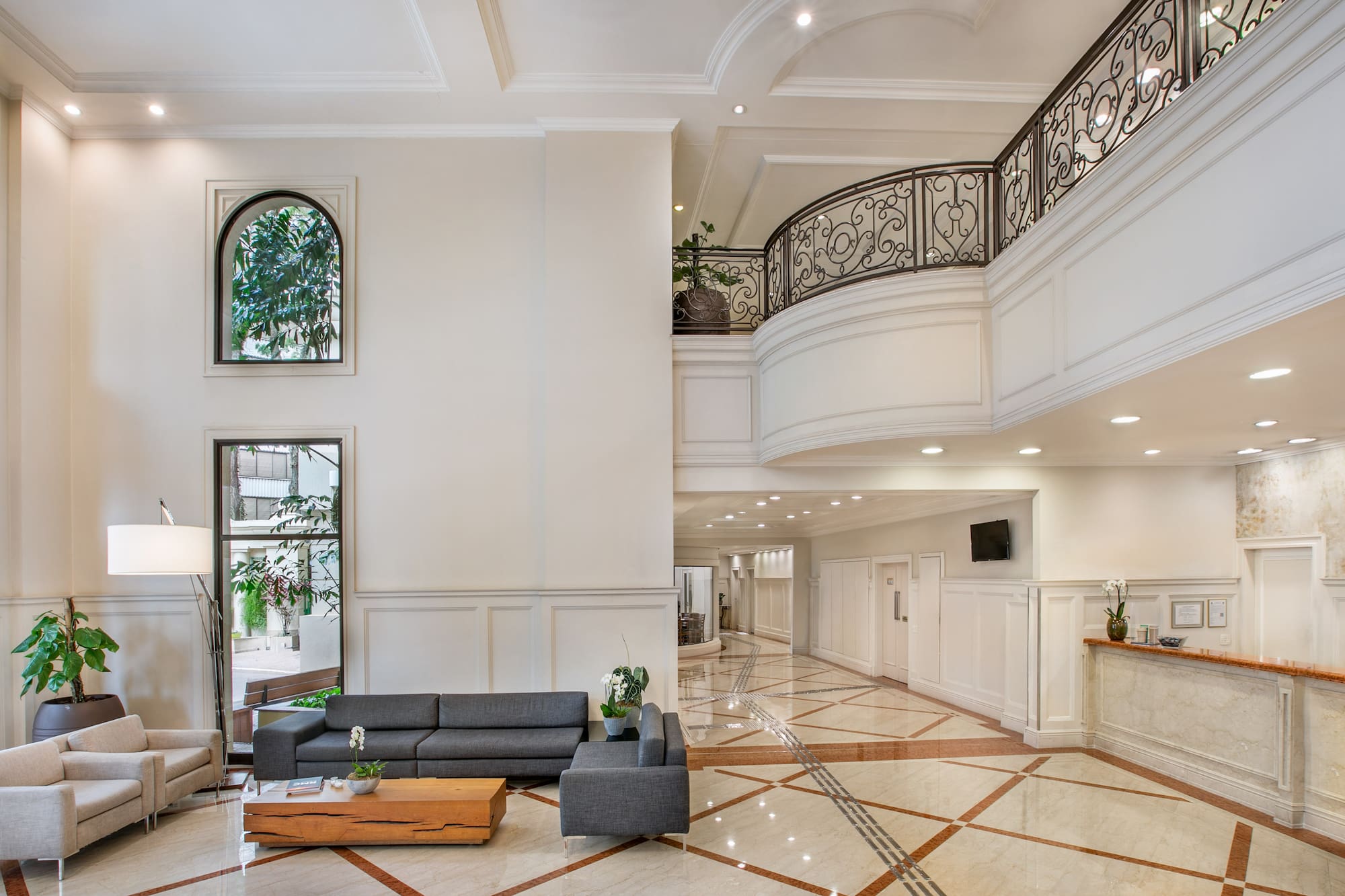 a room with a large staircase and a couch