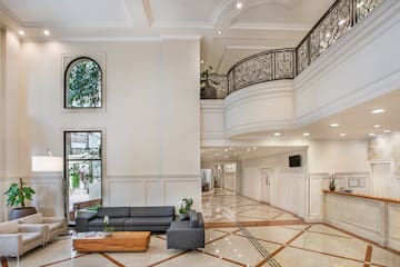 a room with a large staircase and a couch