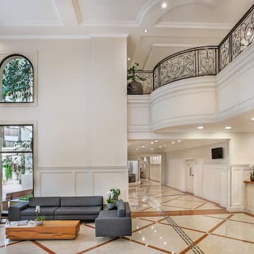 a room with a large staircase and a couch