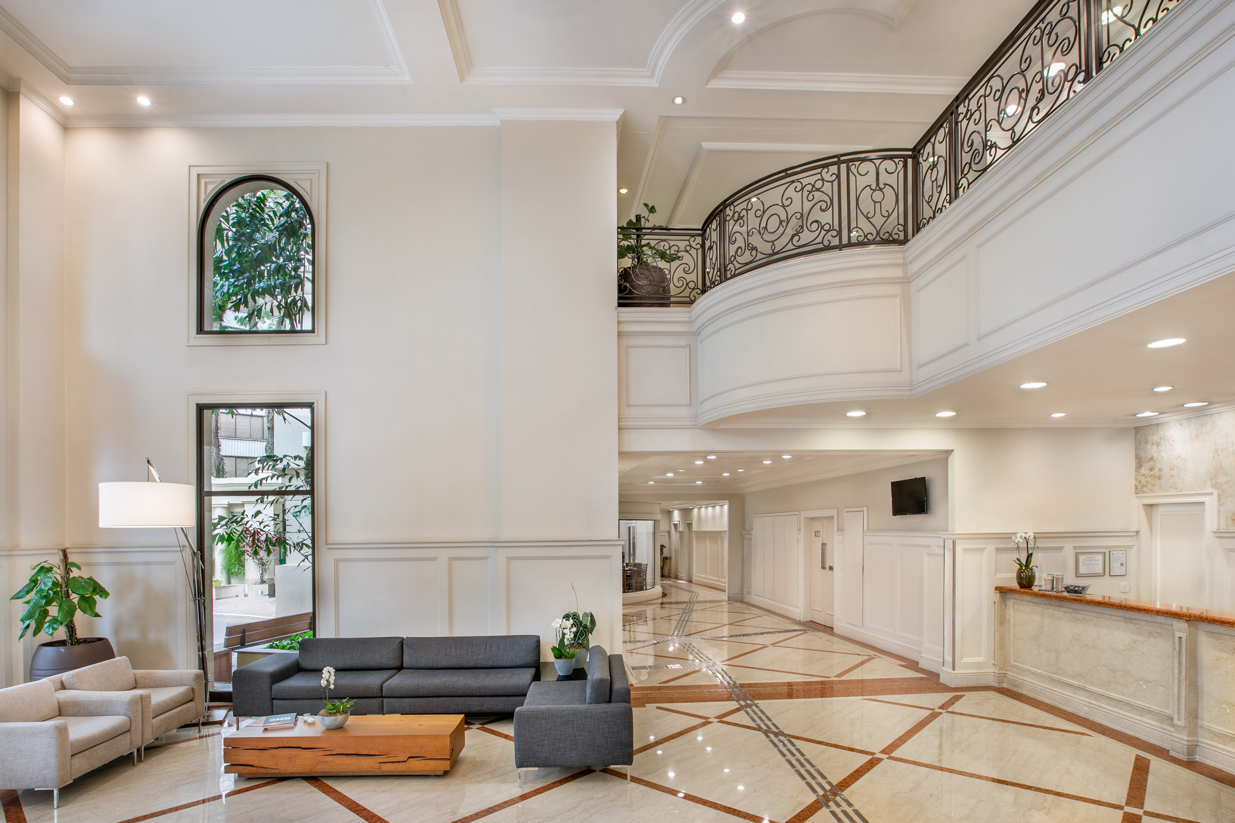 a room with a large staircase and a couch