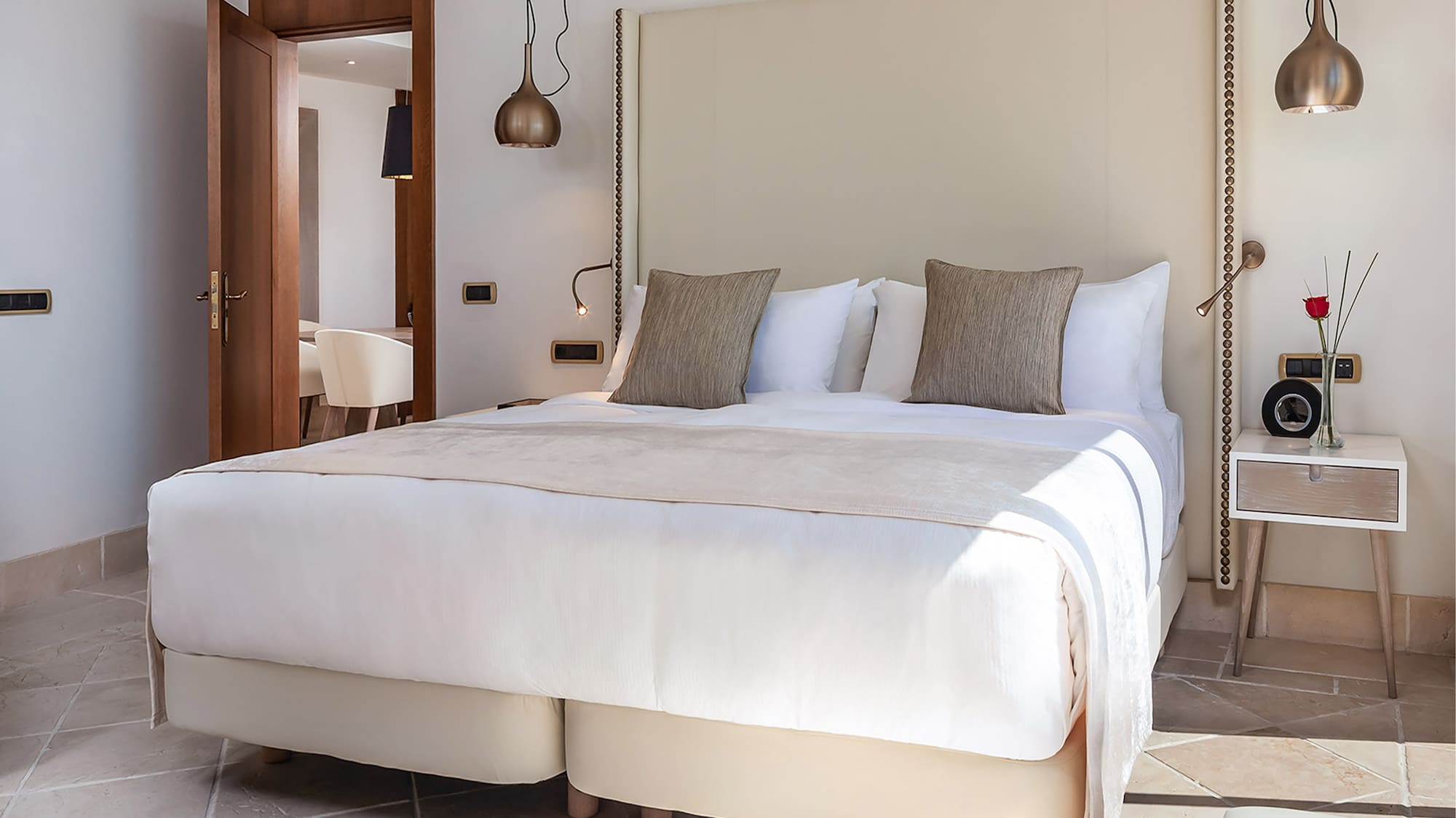 a bed with pillows in a room