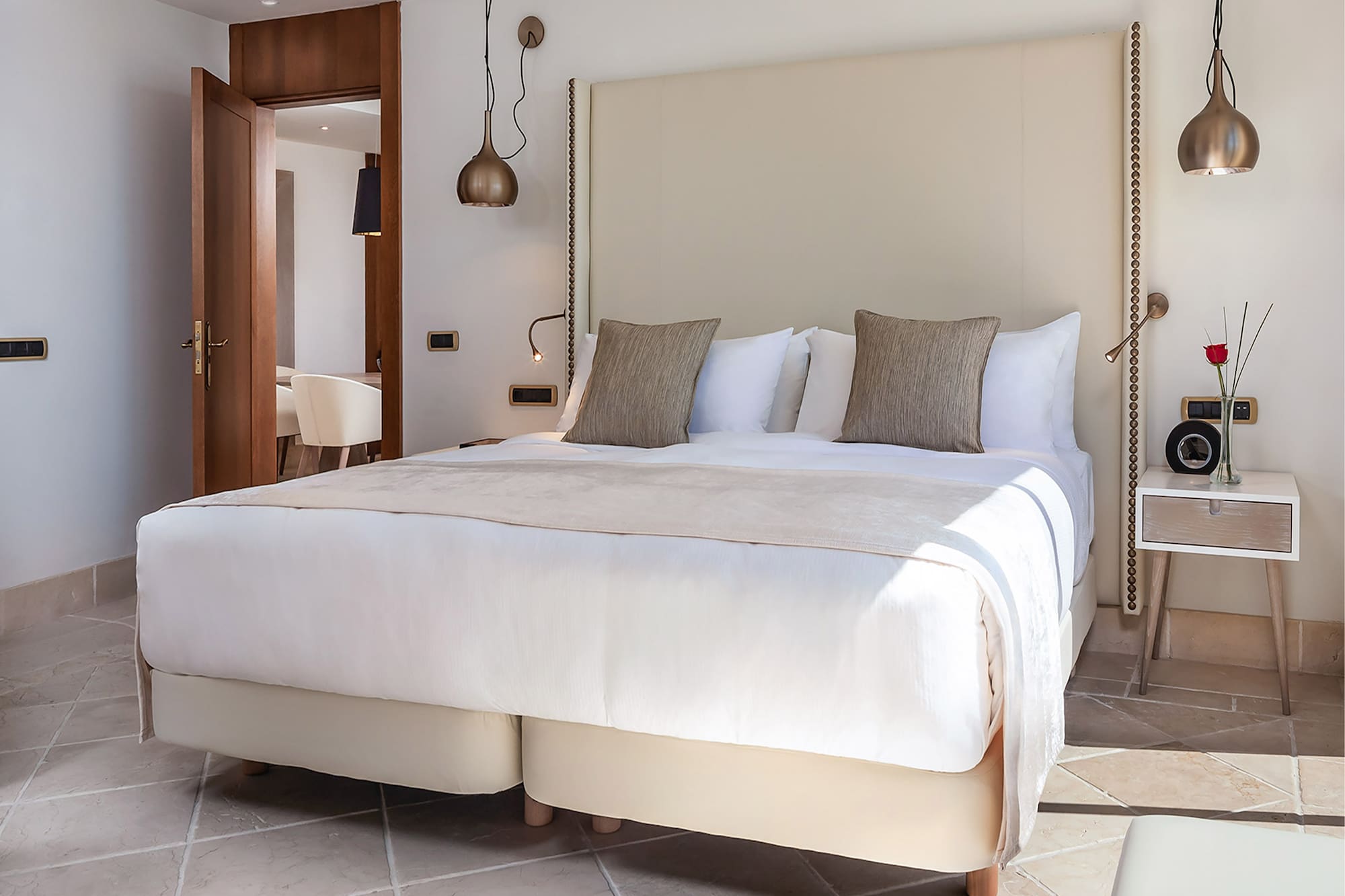 a bed with pillows in a room