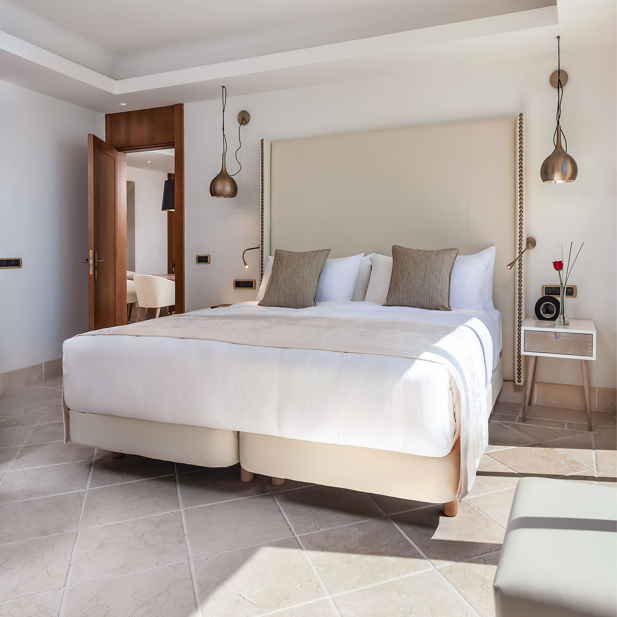 a bed with pillows in a room