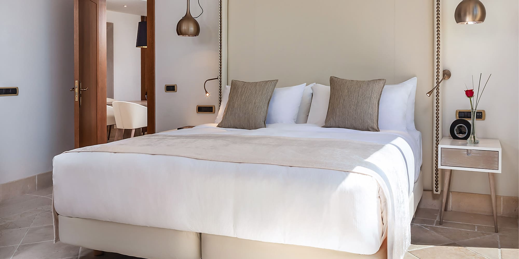 a bed with pillows in a room