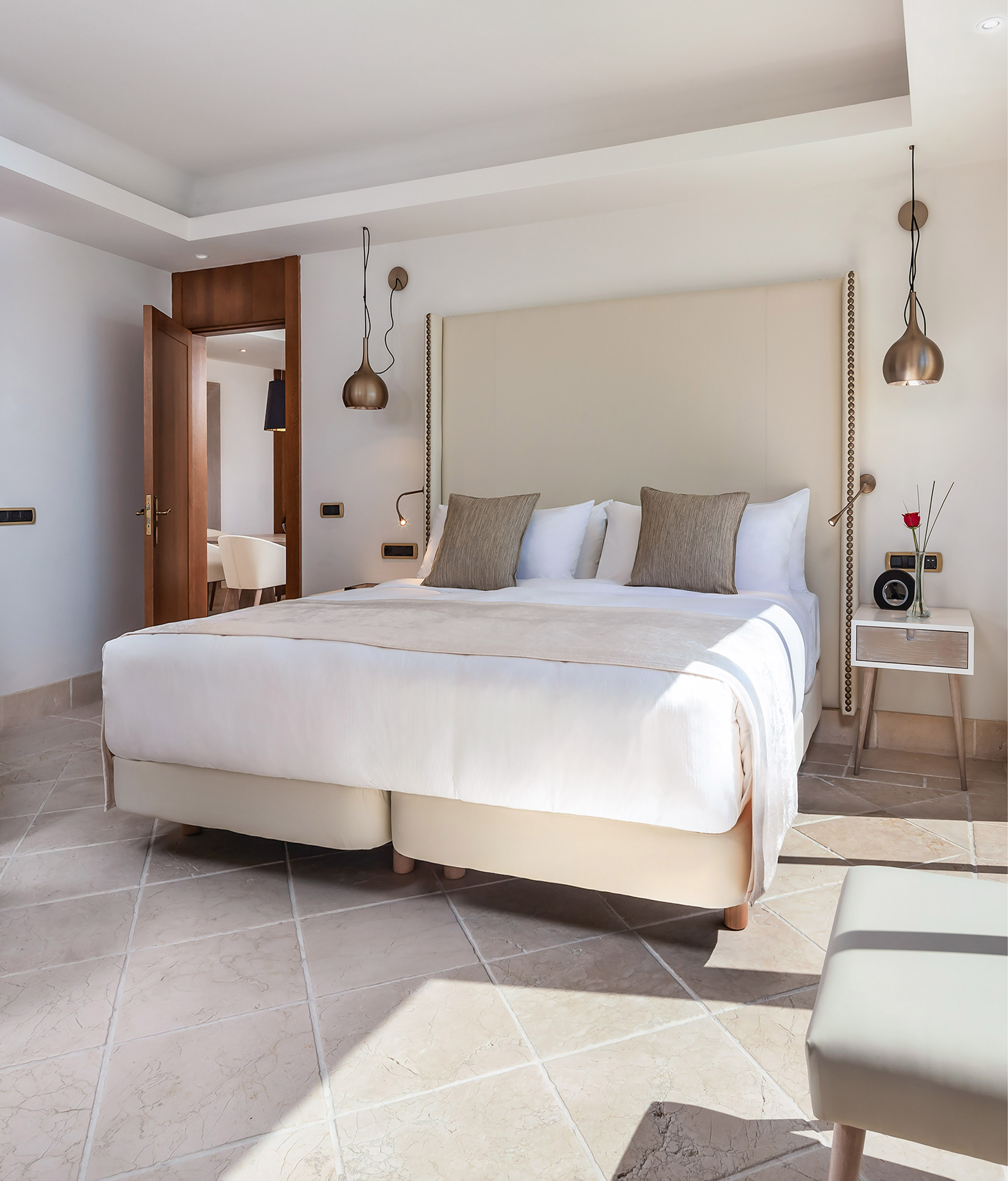 a bed with pillows in a room