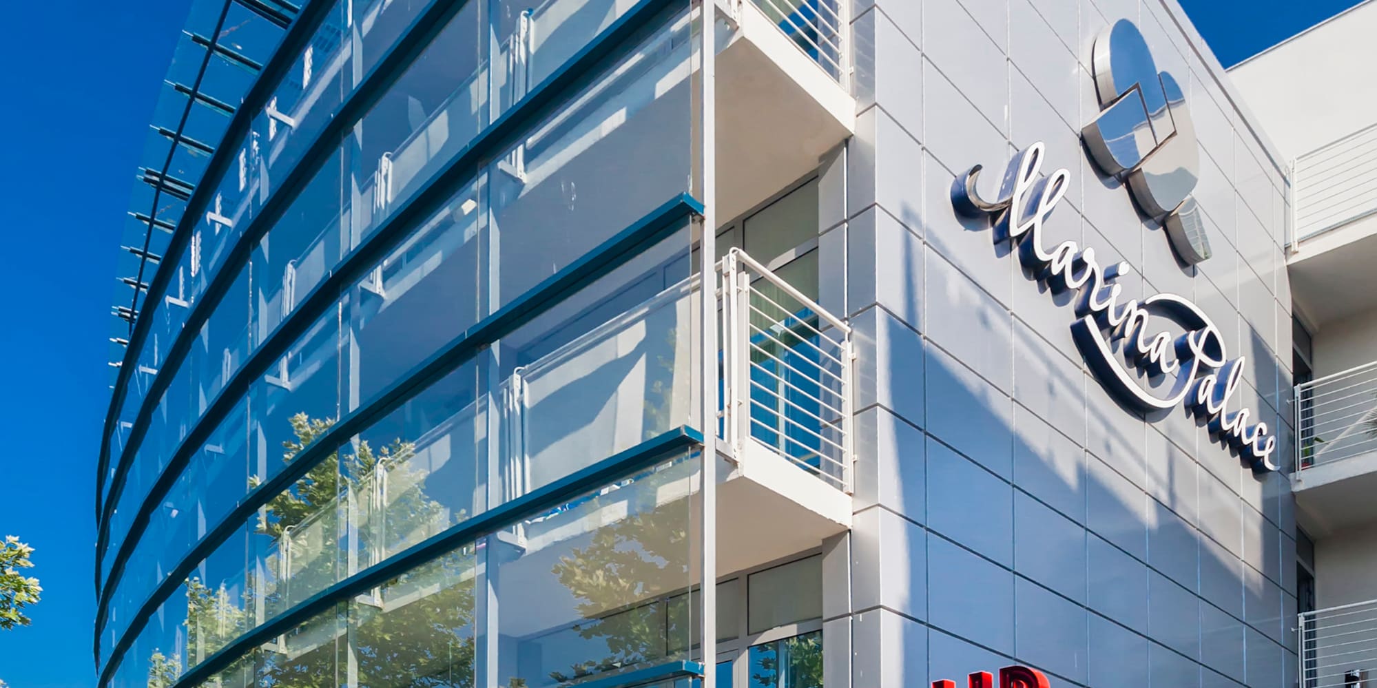 a building with glass walls and a sign