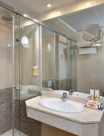 a bathroom with a glass shower door