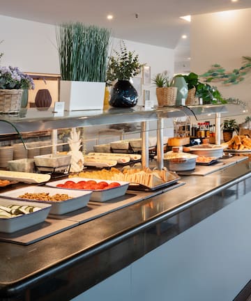 a buffet line with food on it