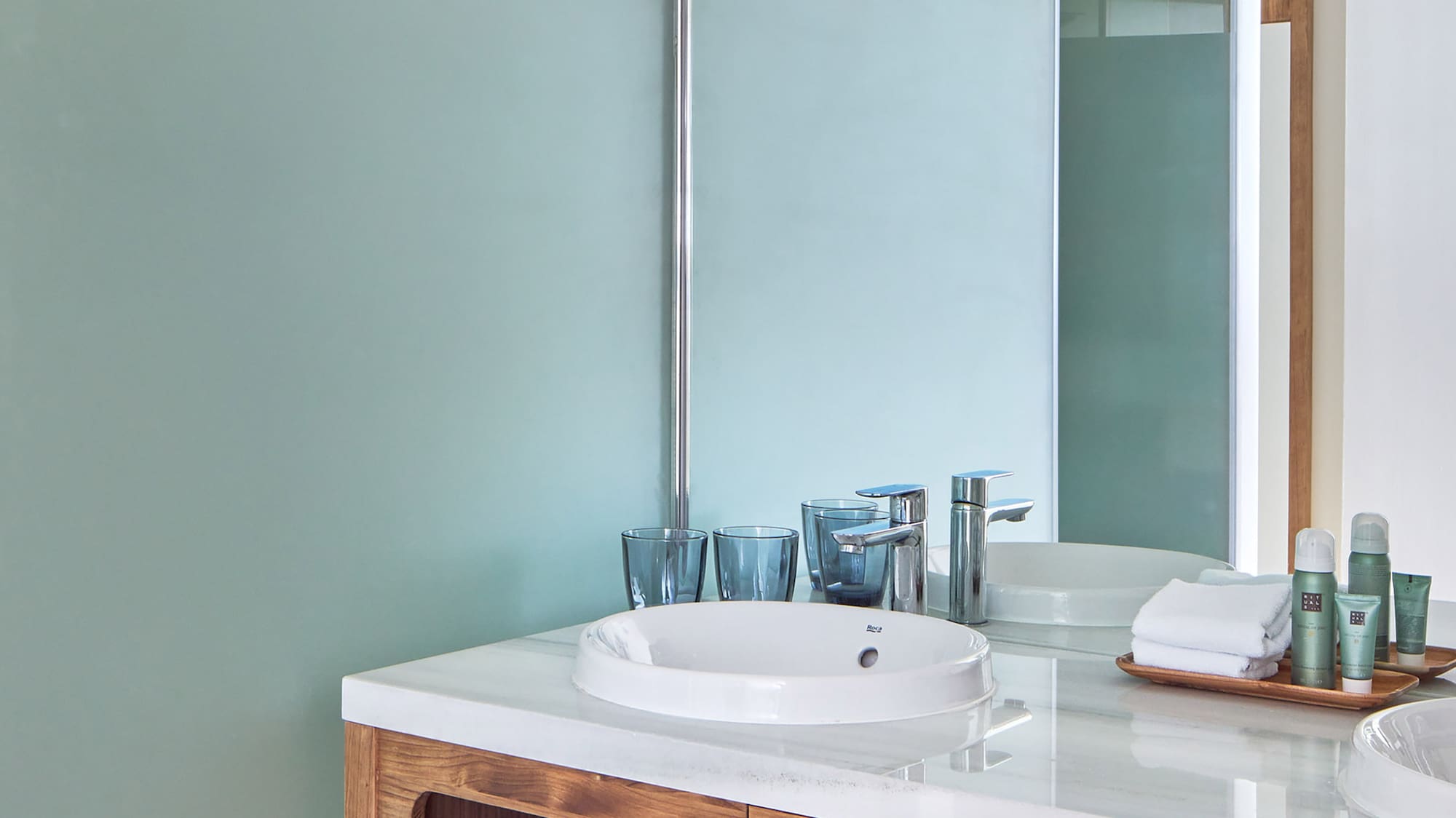 a bathroom with a shower and sink