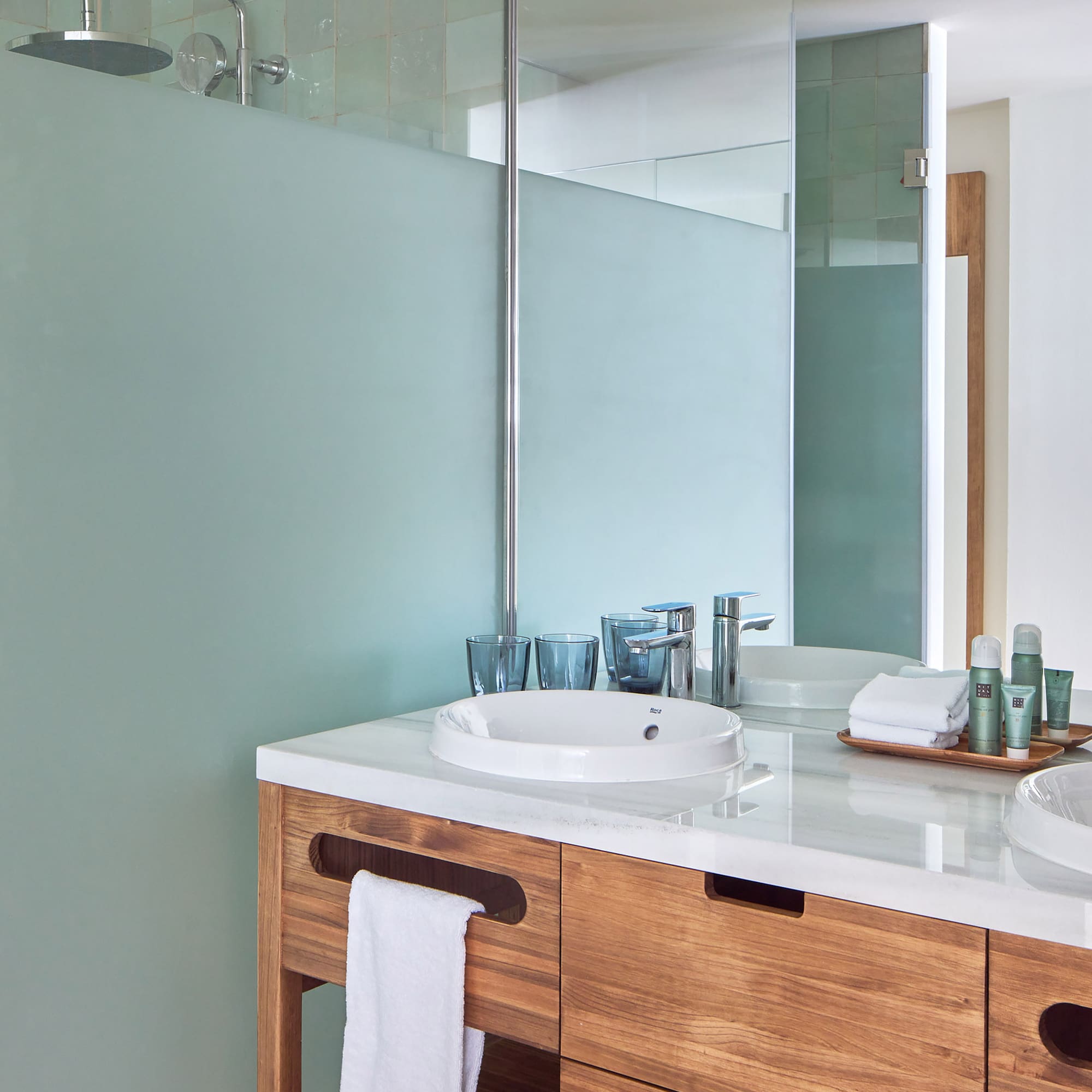 a bathroom with a shower and sink