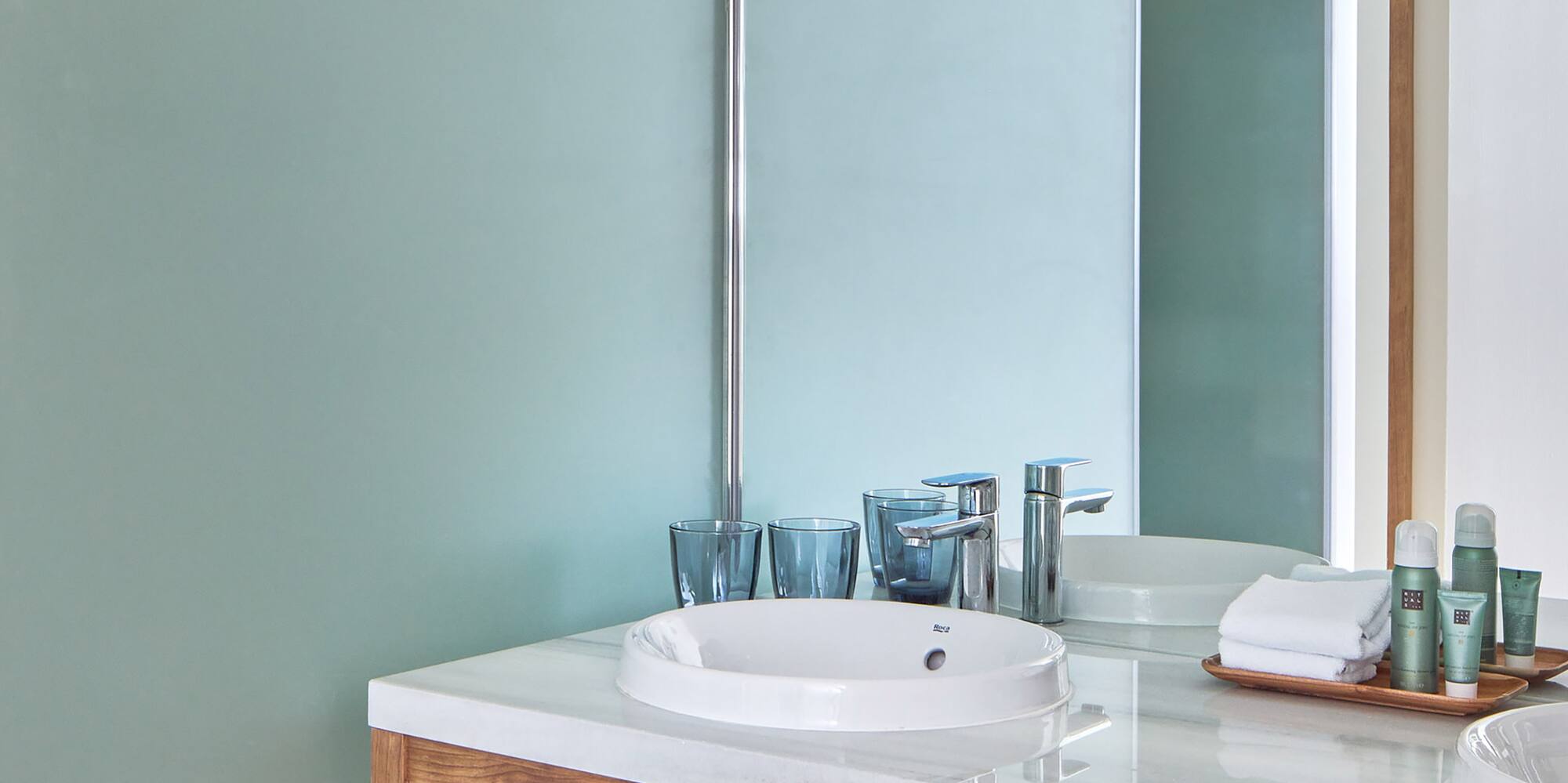 a bathroom with a shower and sink