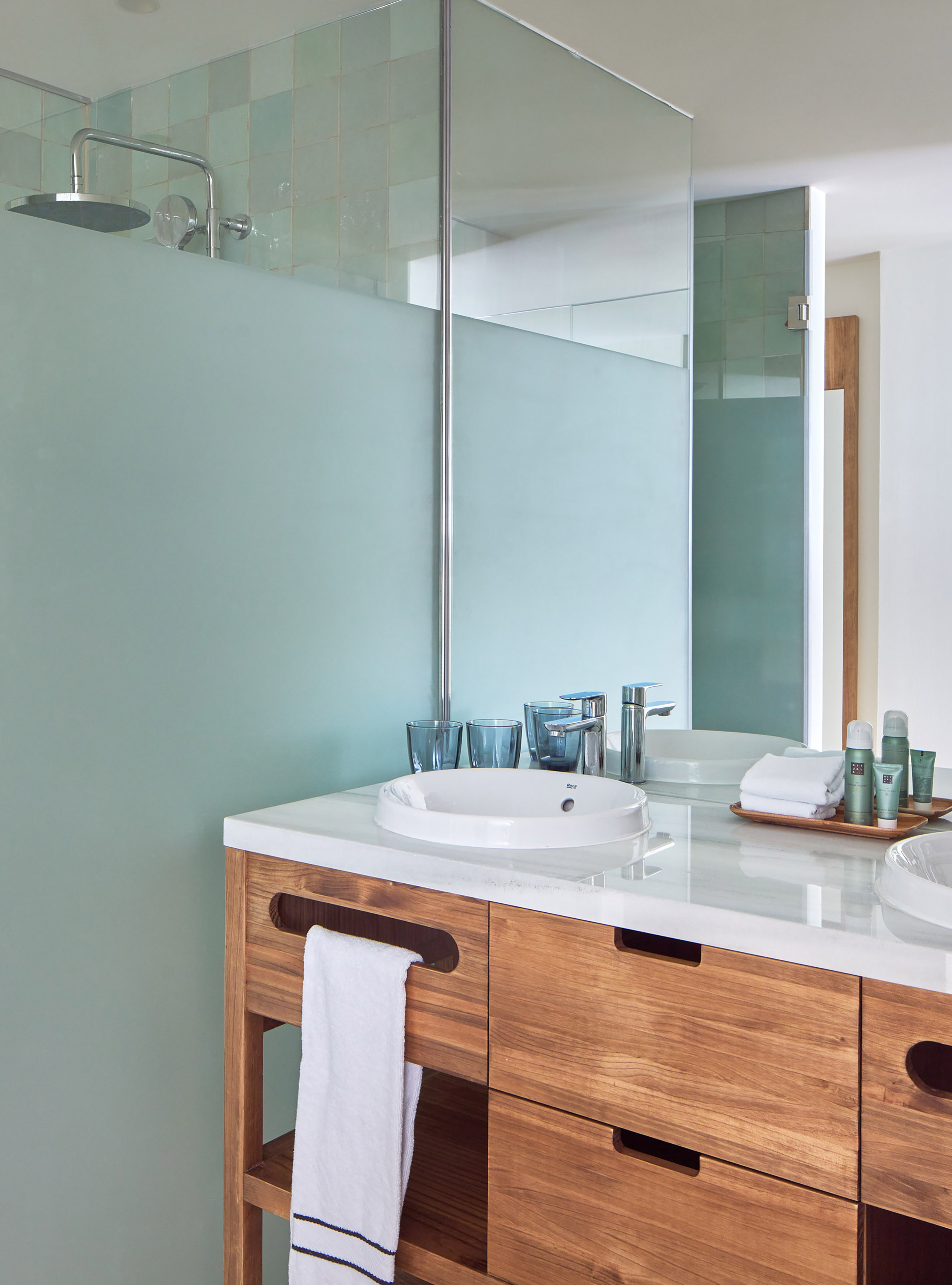 a bathroom with a shower and sink