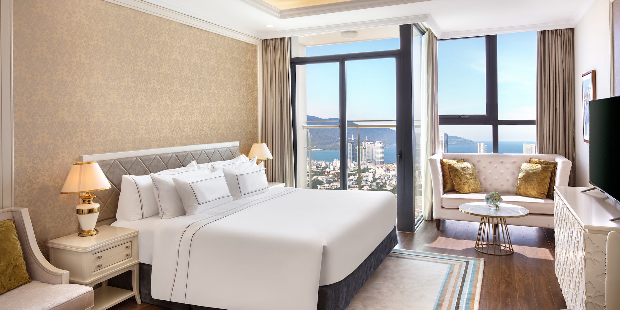 a bedroom with a large window and a large bed