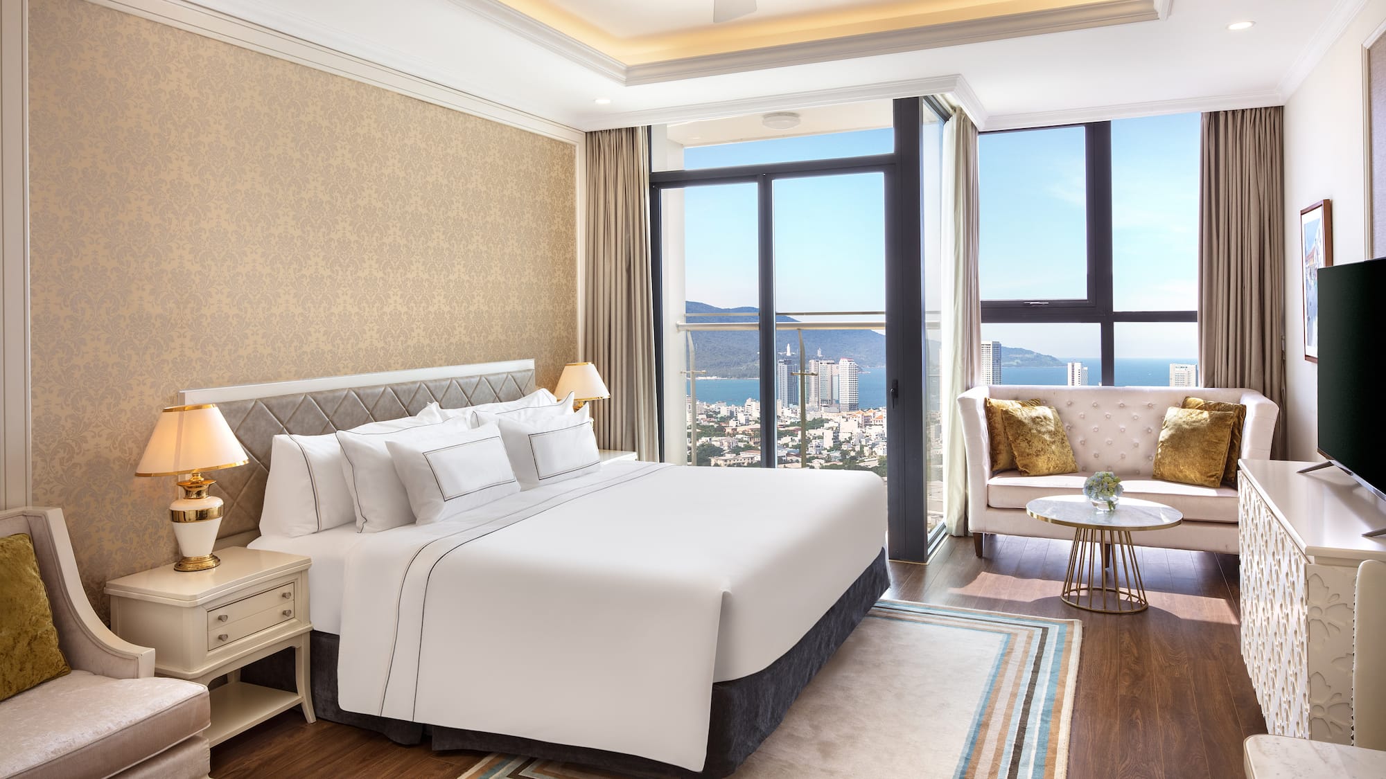 a bedroom with a large window and a large bed