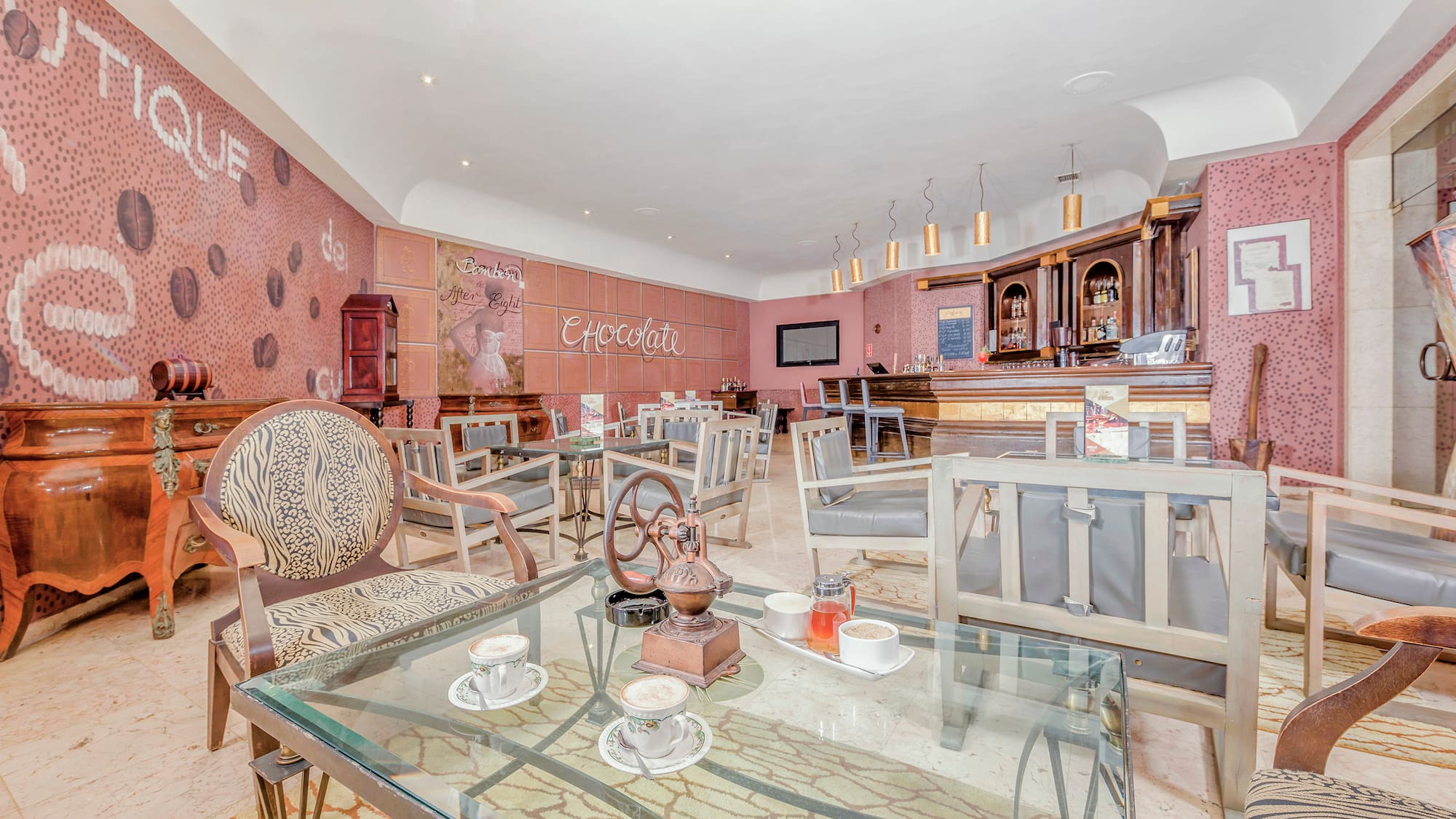 a room with a glass table and chairs