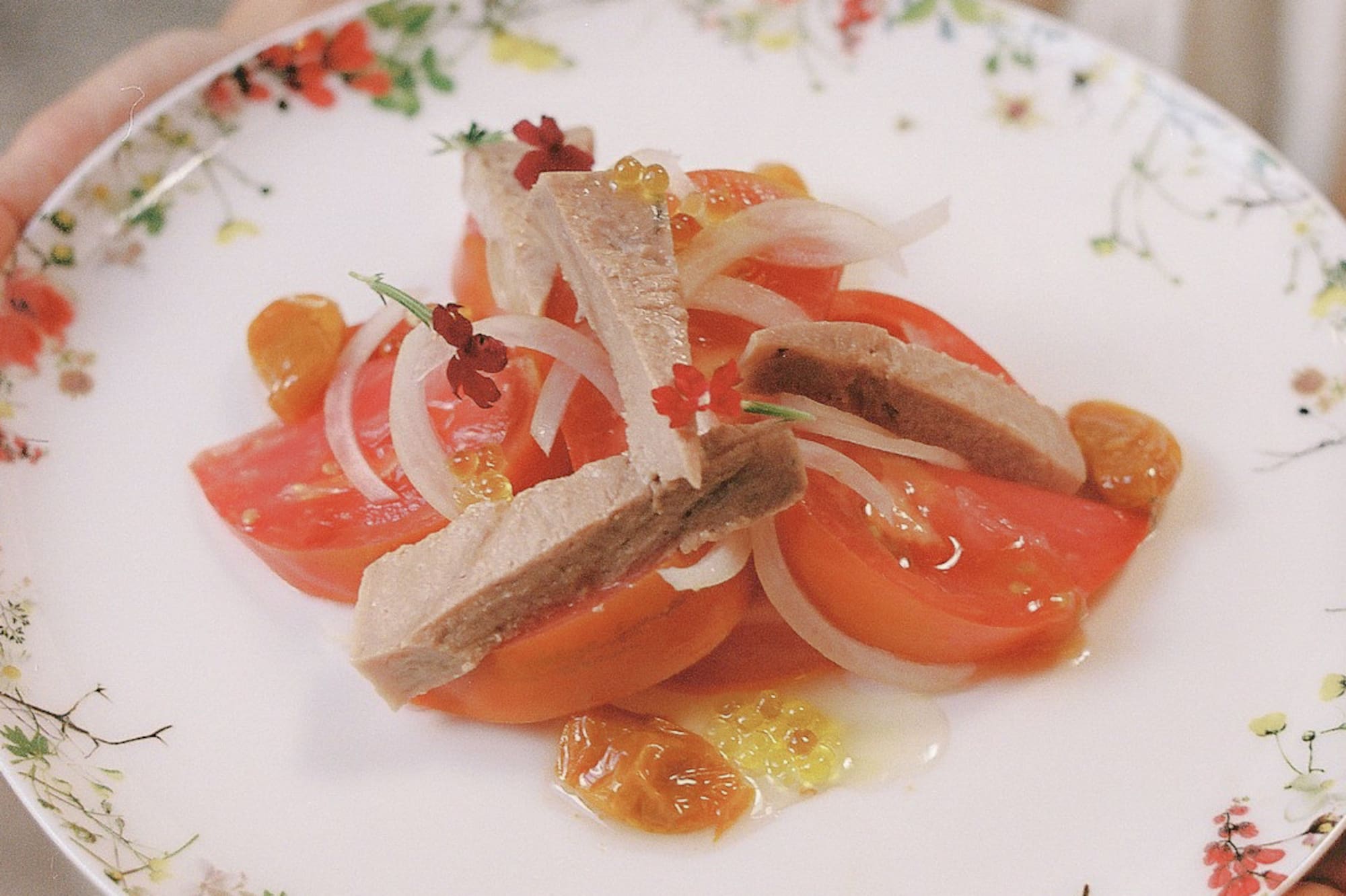 a plate of food with meat and onions