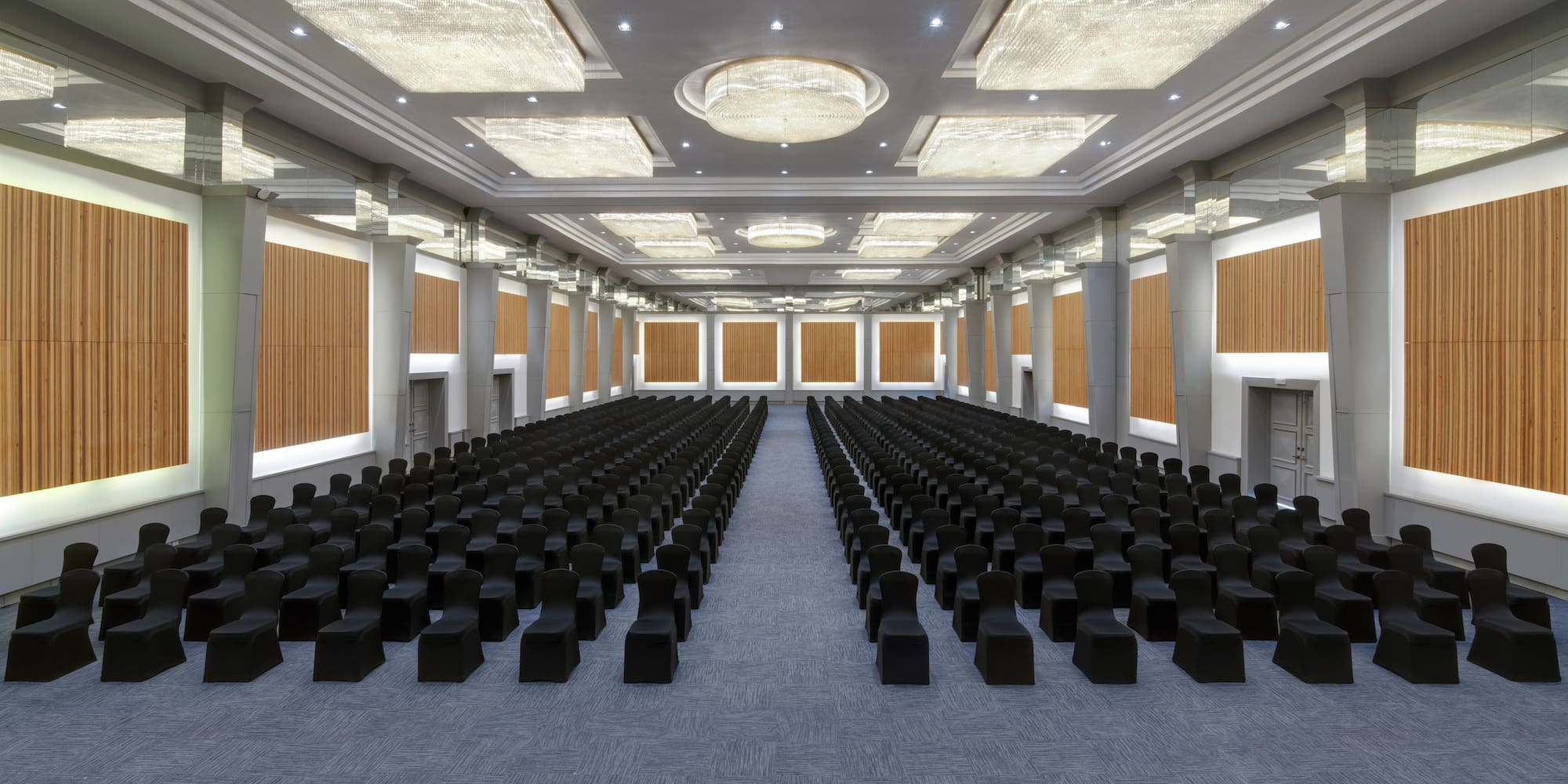 a large room with black chairs