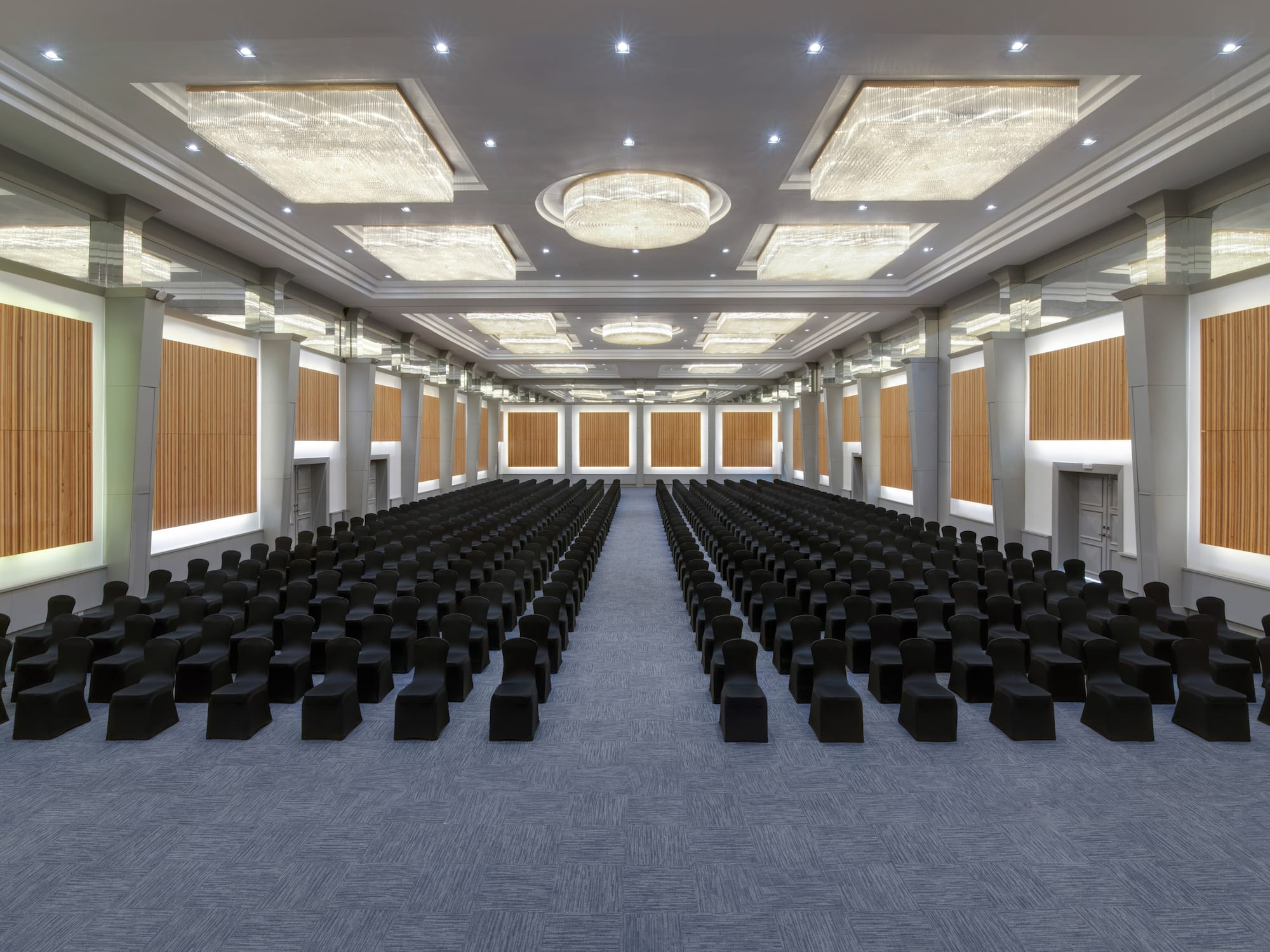a large room with black chairs