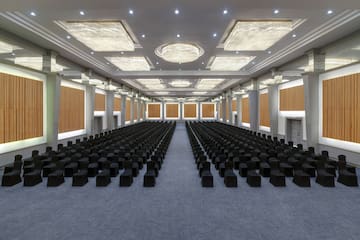a large room with black chairs