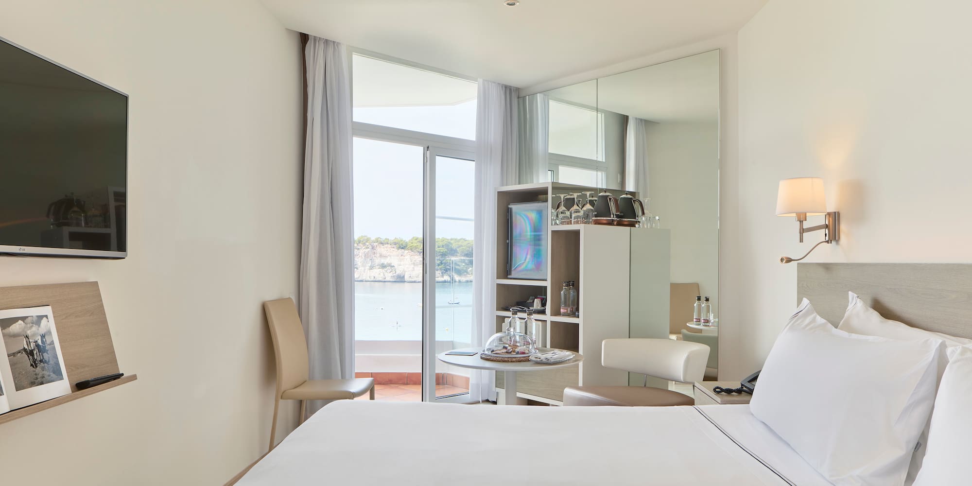 a room with a bed and a mirror