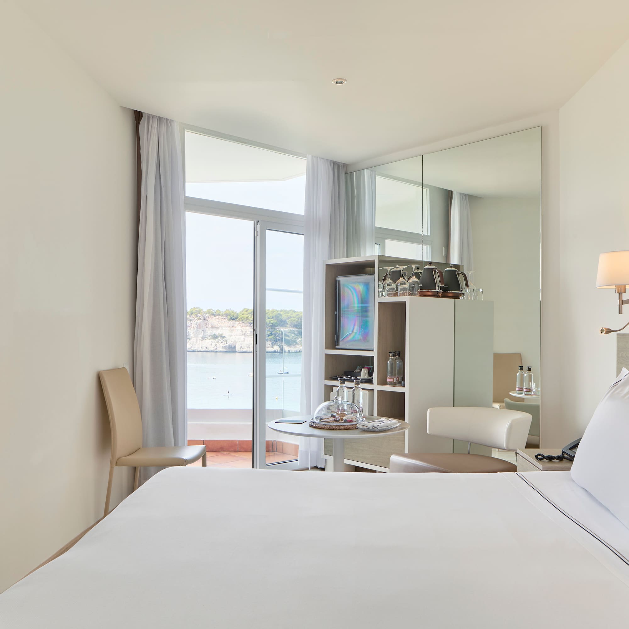 a room with a bed and a mirror