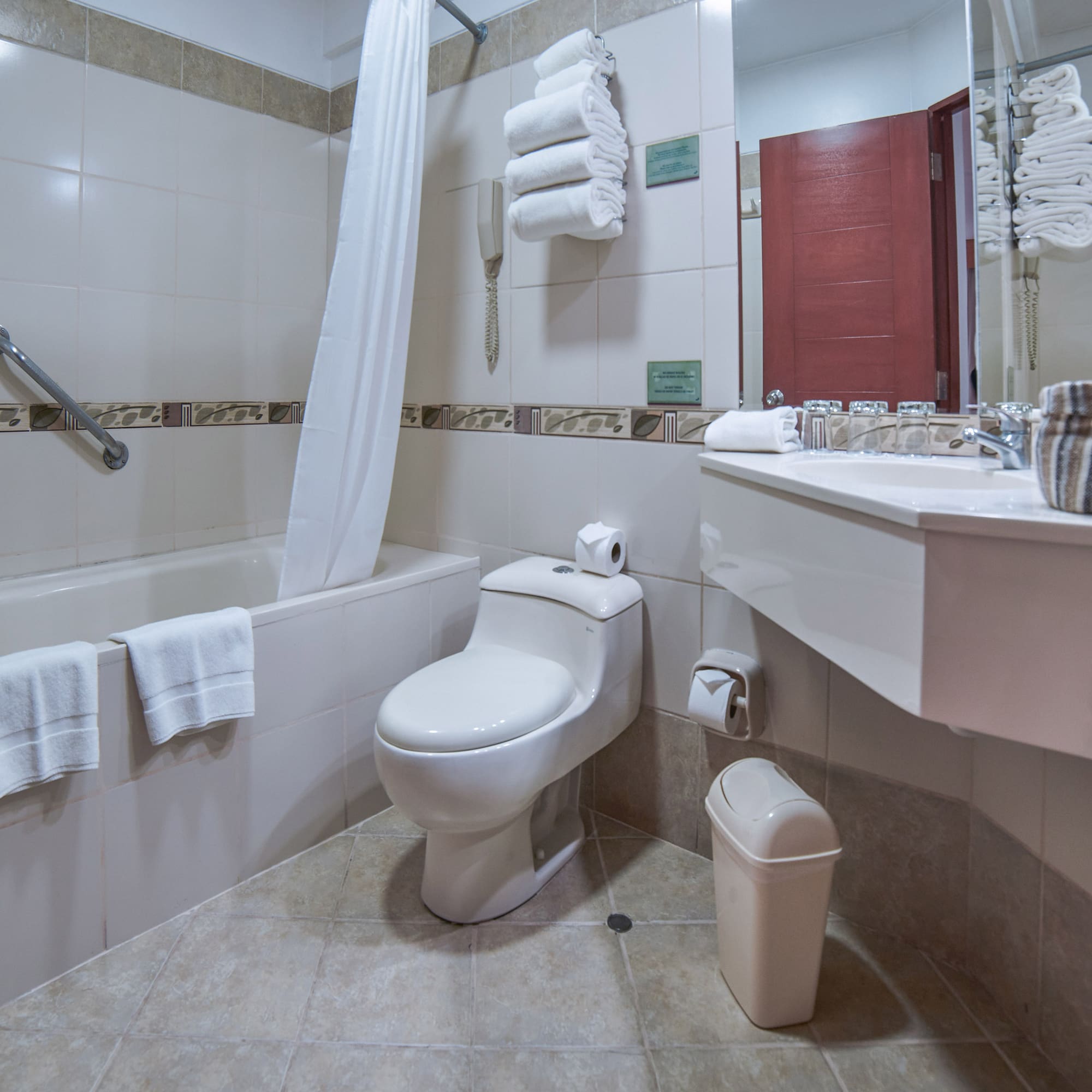 a bathroom with a toilet and bathtub