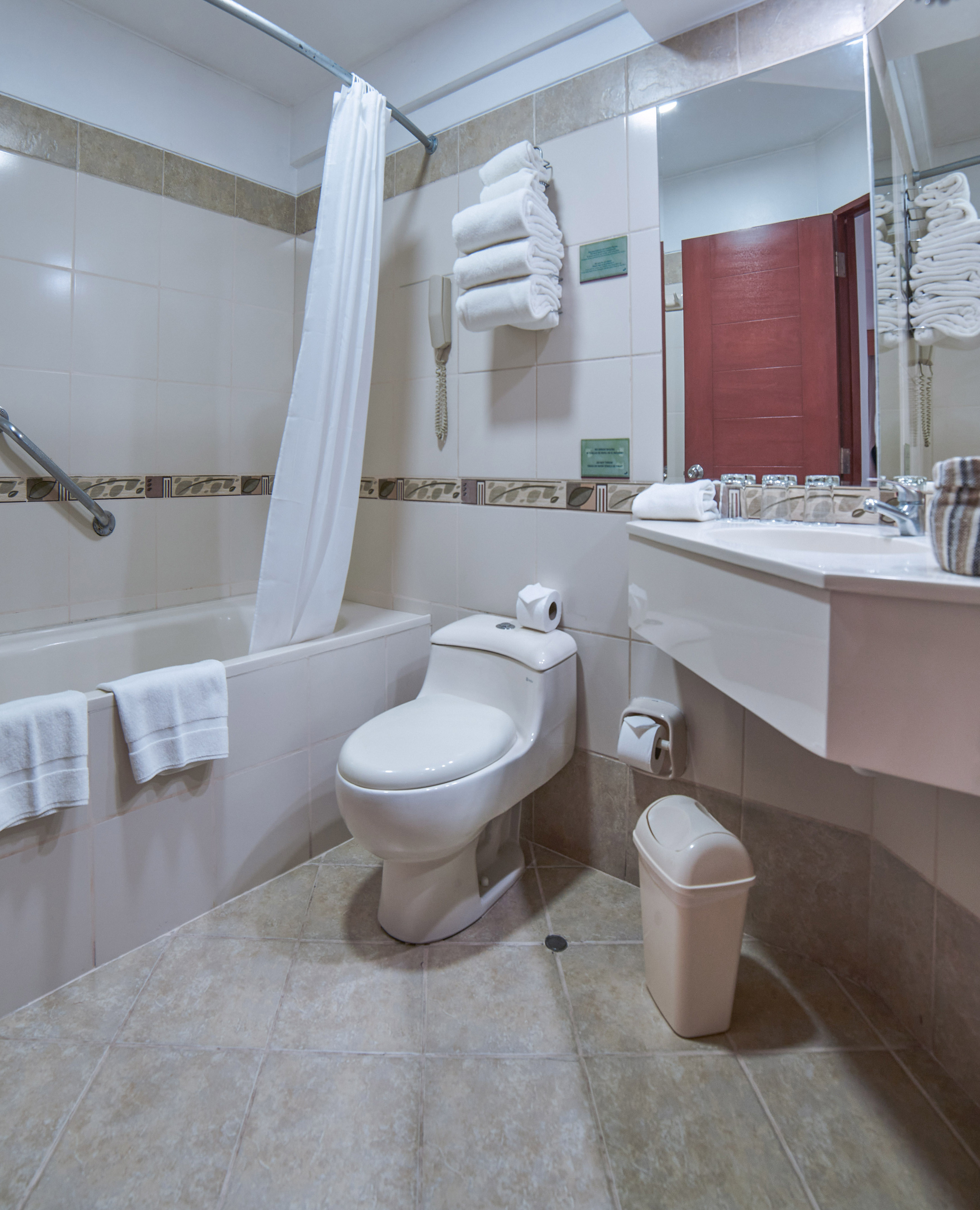 a bathroom with a toilet and bathtub