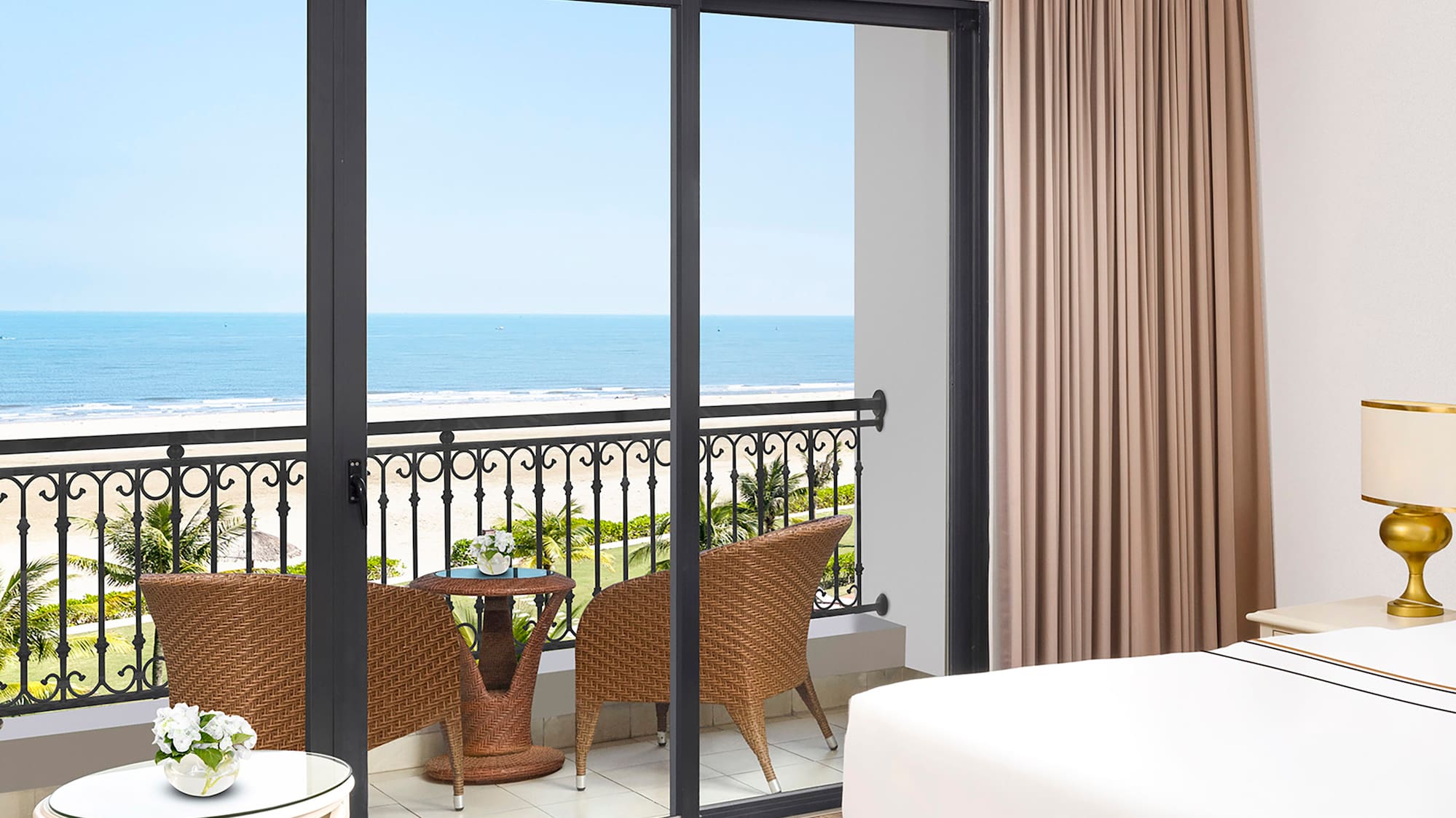 a room with a balcony overlooking the ocean
