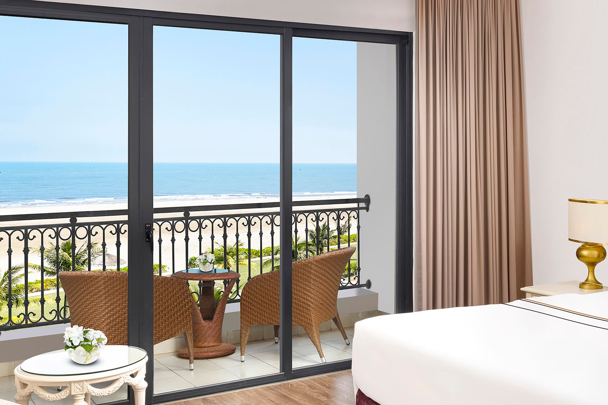 a room with a balcony overlooking the ocean