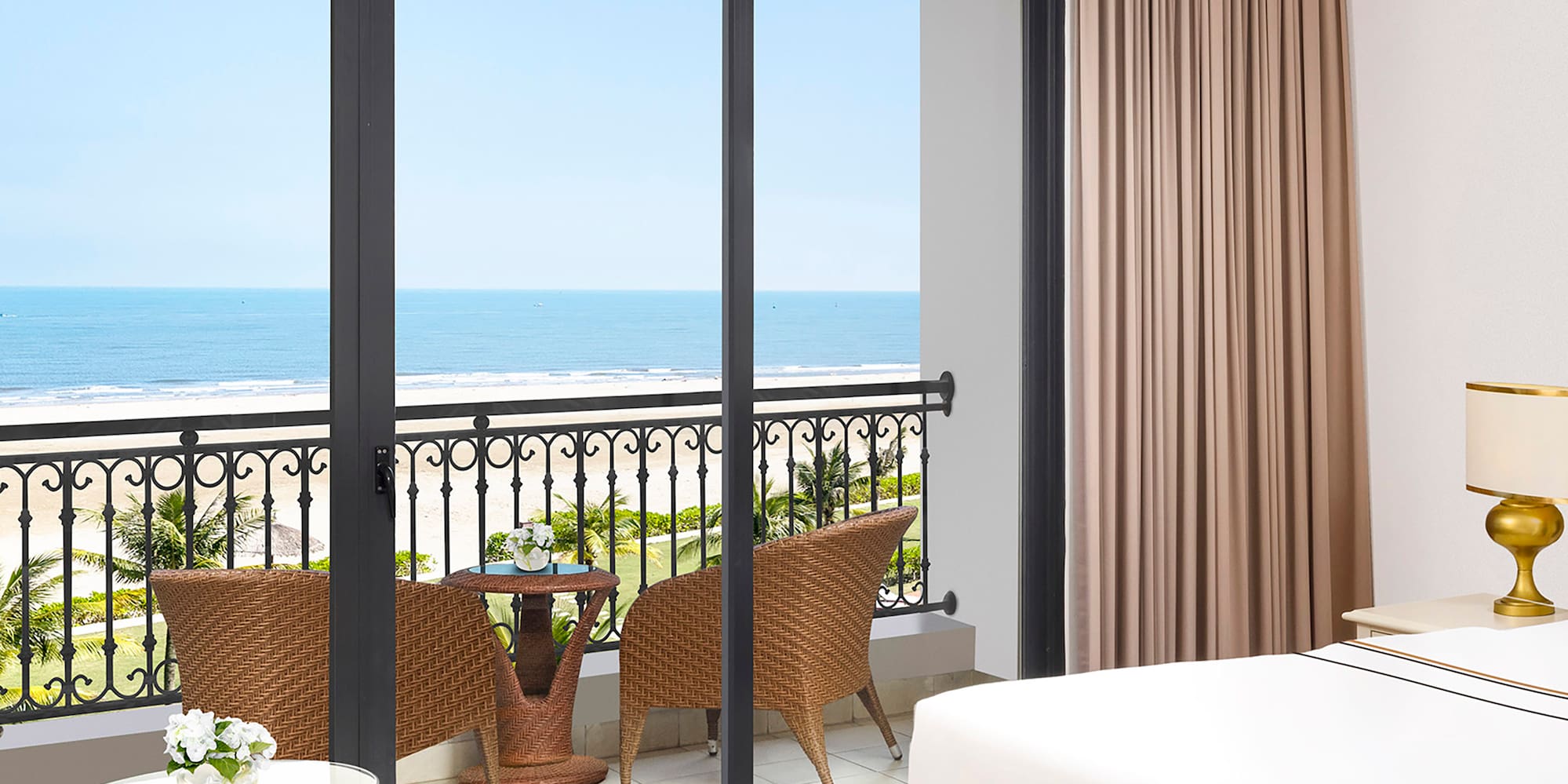 a room with a balcony overlooking the ocean