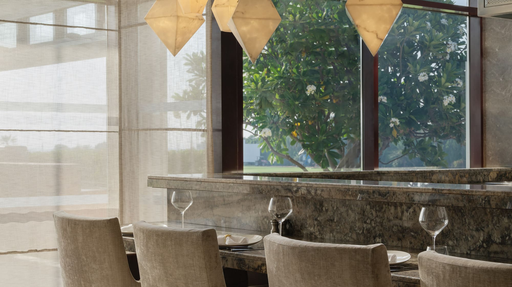 a dining room with a table and chairs