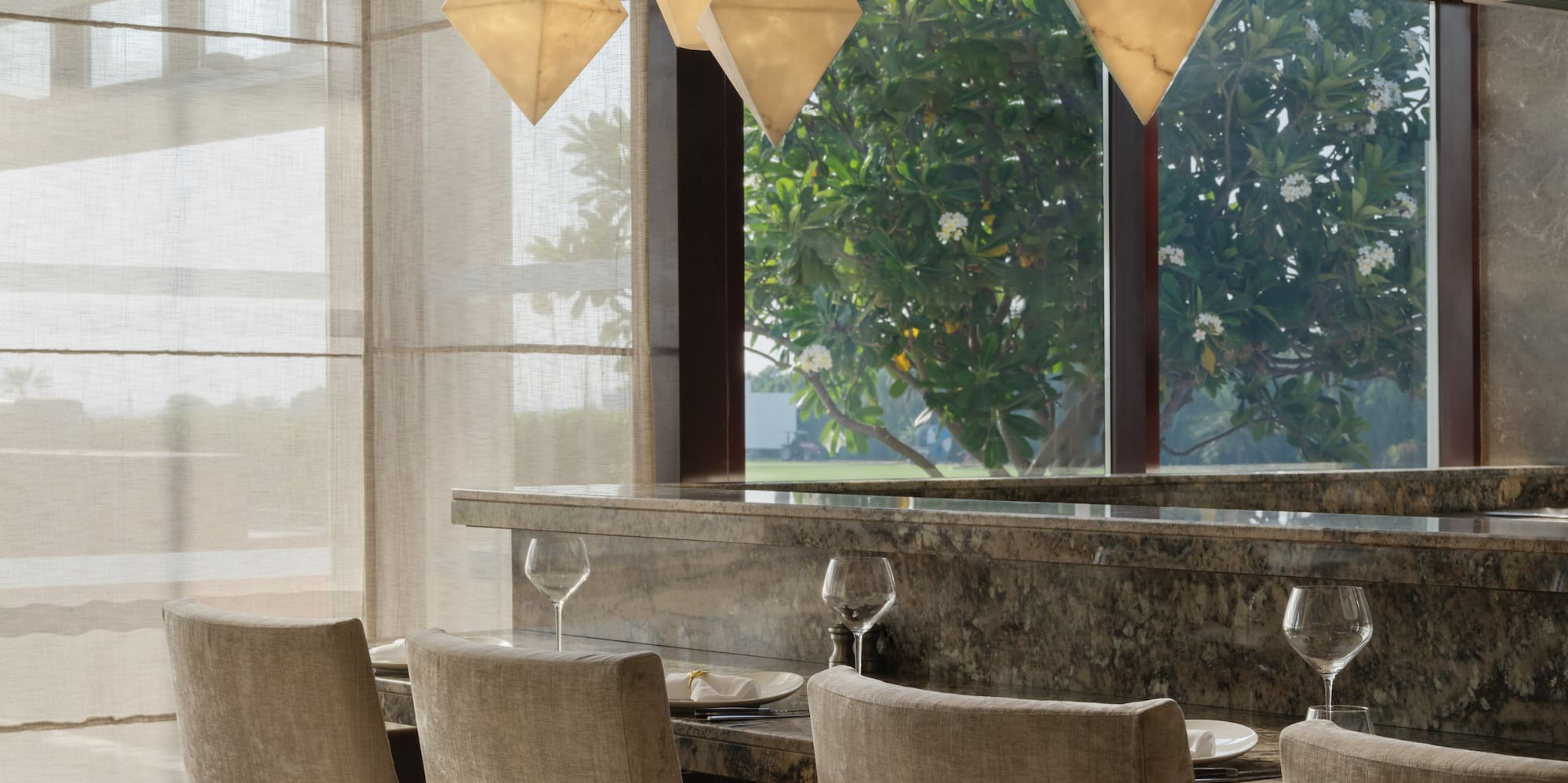 a dining room with a table and chairs