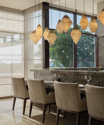 a dining room with a table and chairs