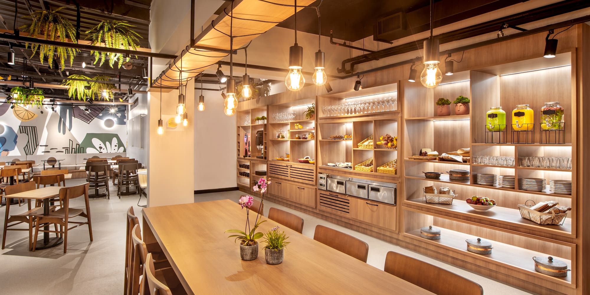 a room with a table and chairs and a shelf with food