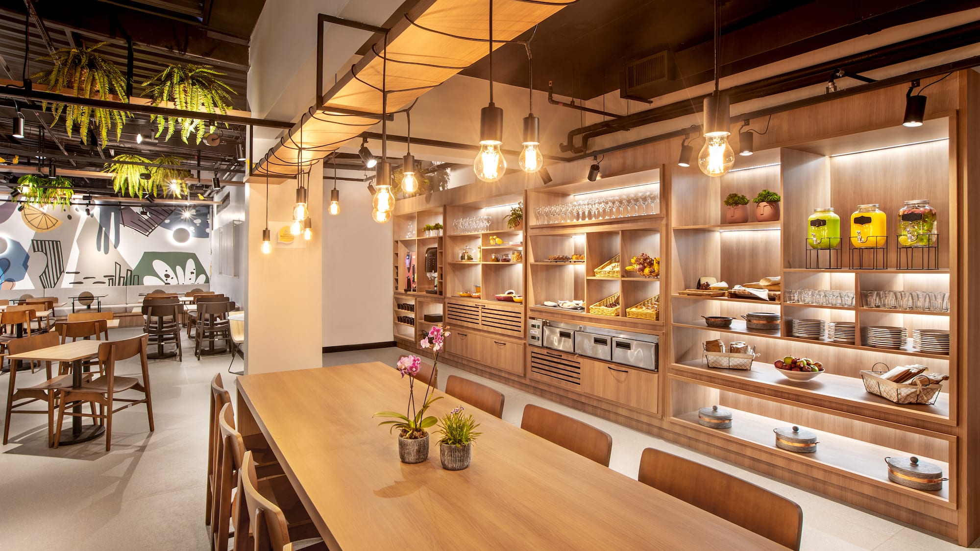 a room with a table and chairs and a shelf with food