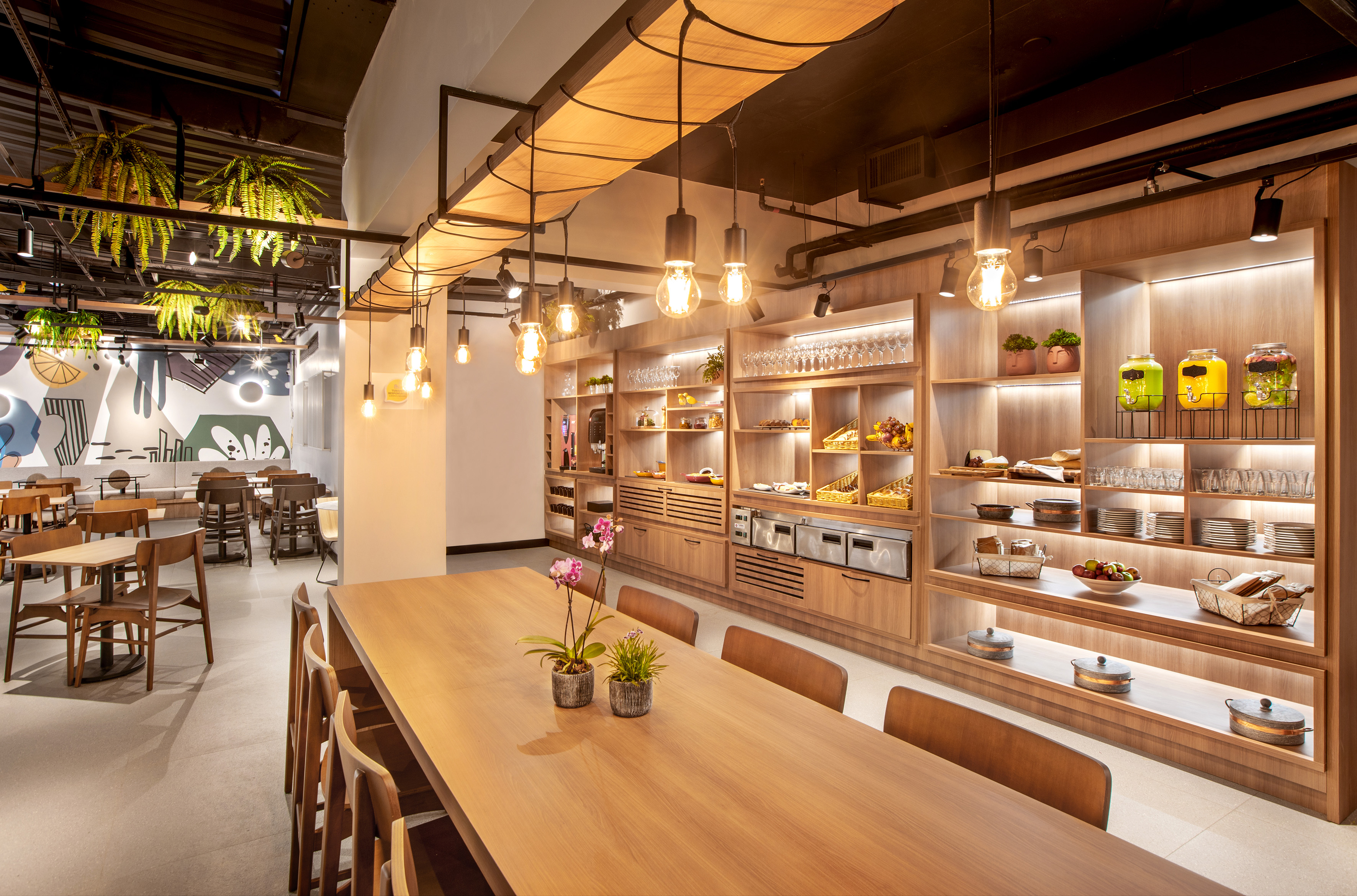 a room with a table and chairs and a shelf with food