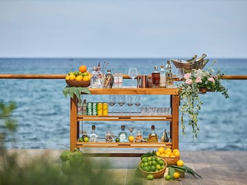 a bar with bottles and glasses on it