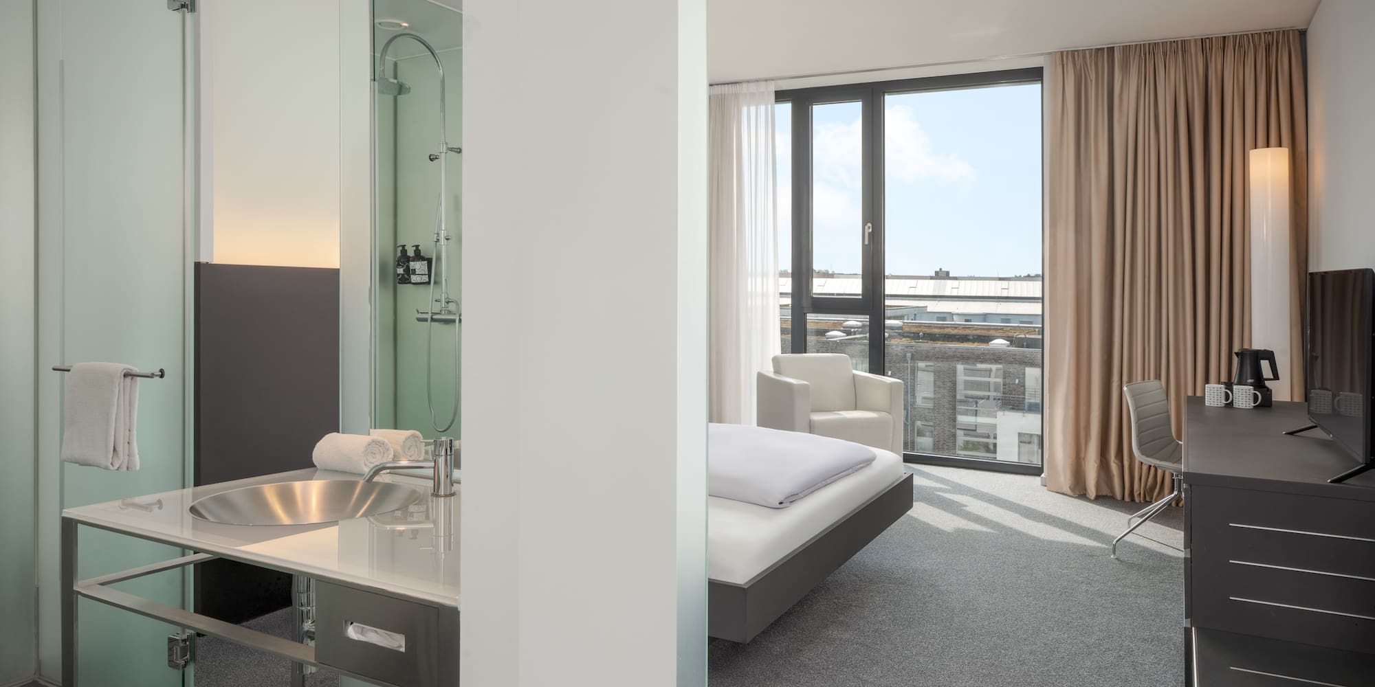 a room with a bed and a sink