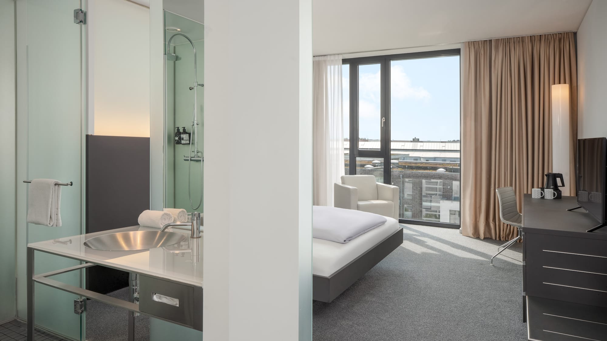 a room with a bed and a sink