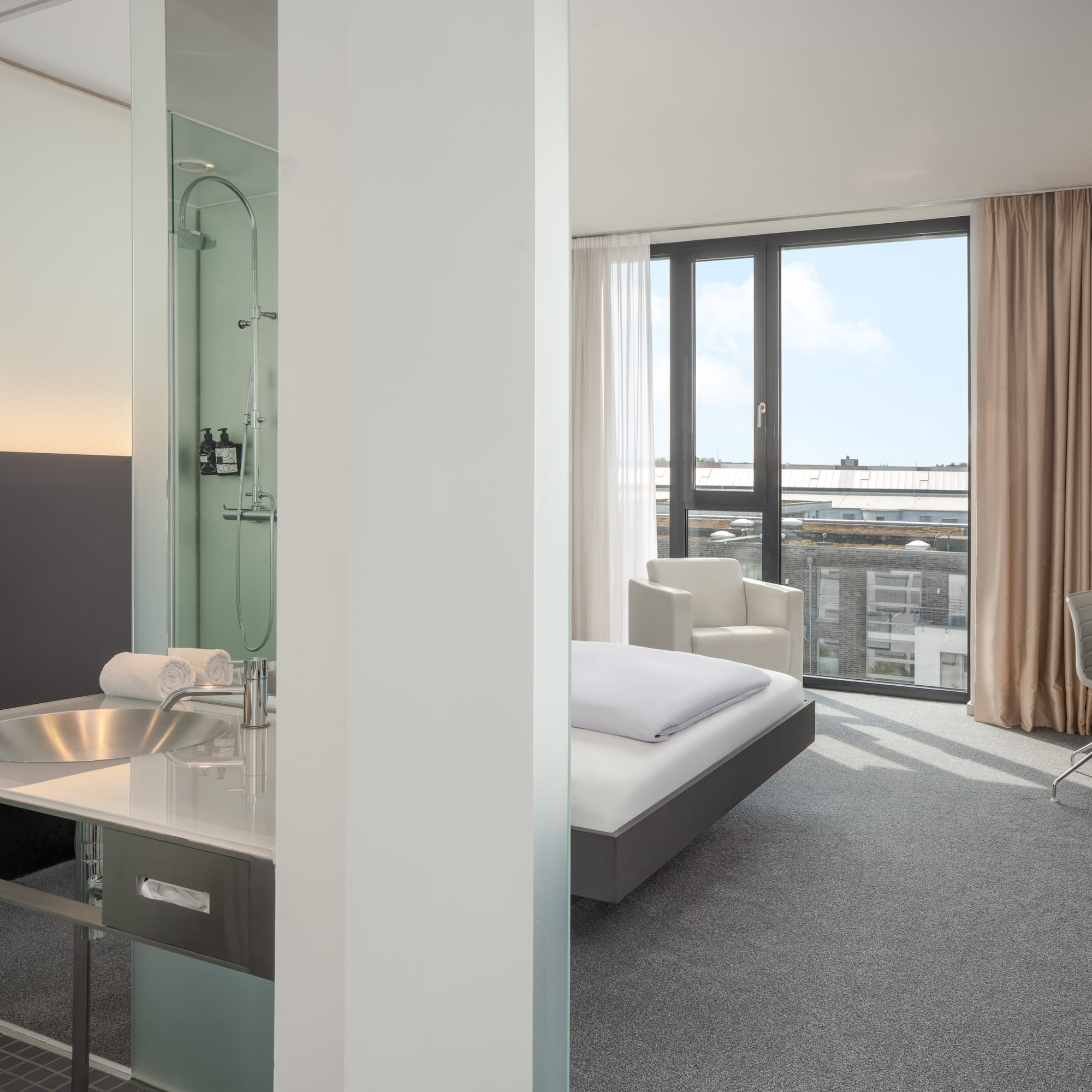 a room with a bed and a sink