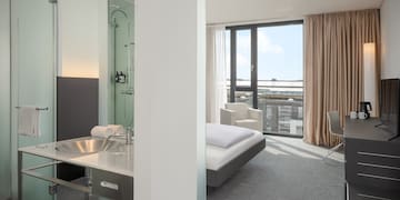 a room with a bed and a sink