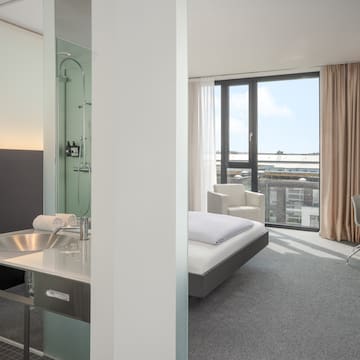 a room with a bed and a sink