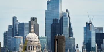 a city skyline with a large building and tall buildings