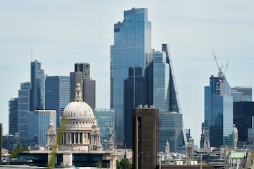 a city skyline with a large building and tall buildings