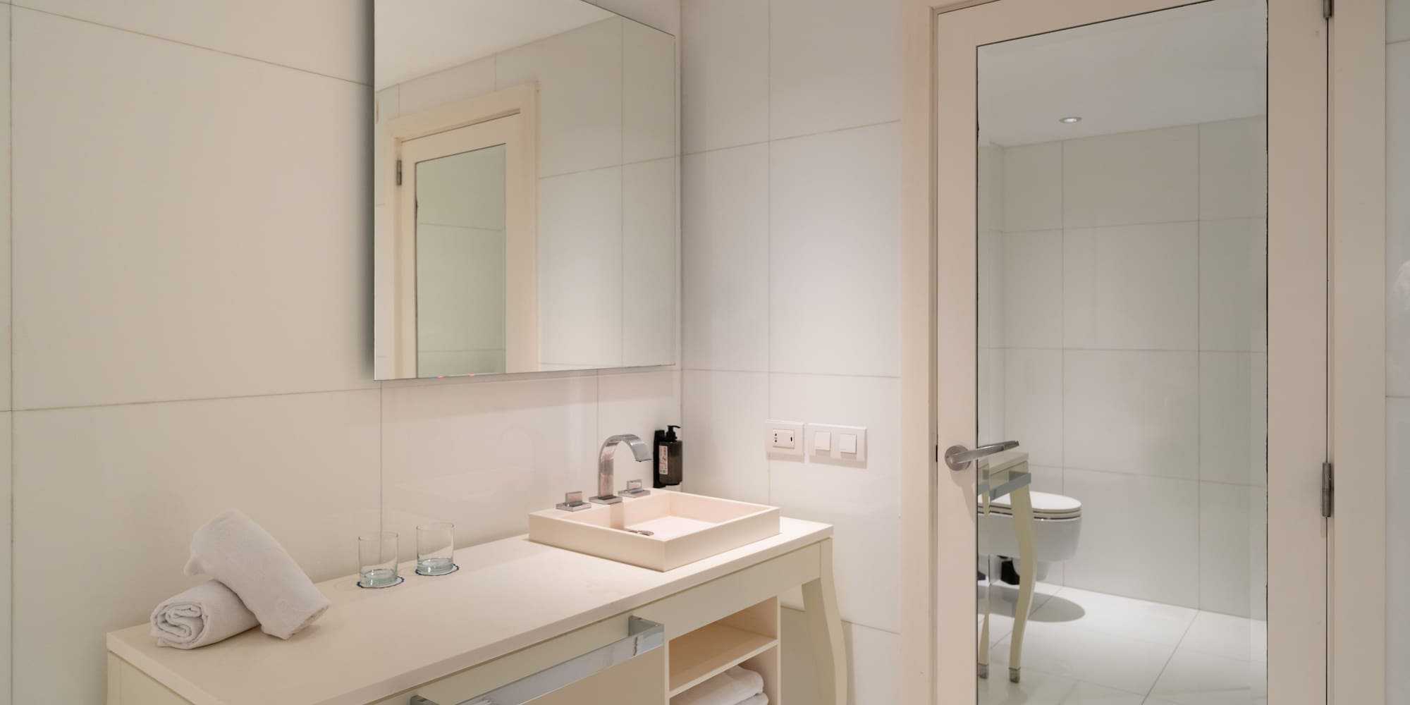 a bathroom with a mirror and sink