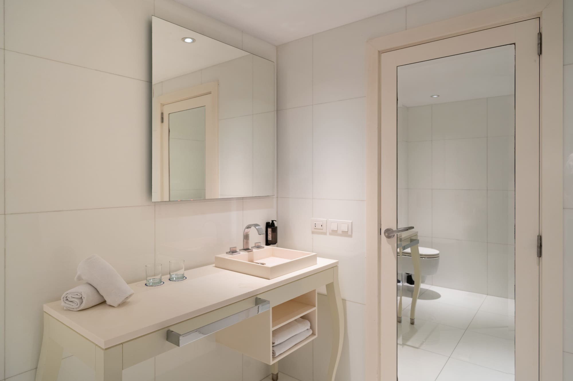 a bathroom with a mirror and sink